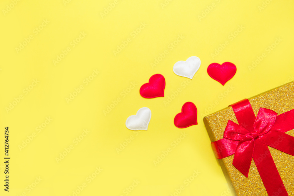 Happy Valentine's Day flatlay. Top view present gift box, hearts on on yellow color of the year 2021 background. Valentine day or New Year greeting card. panton