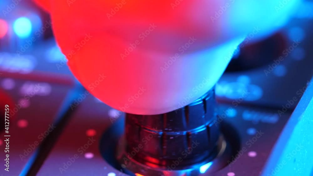 Adjusting a control knob of a device micro close-up shot of the finger turning it