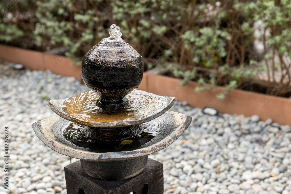 Antique fountain at garden. jar fountain in the garden. fountain in garden decoration Antique fountain at garden. jar fountain in the garden. fountain in garden decoration