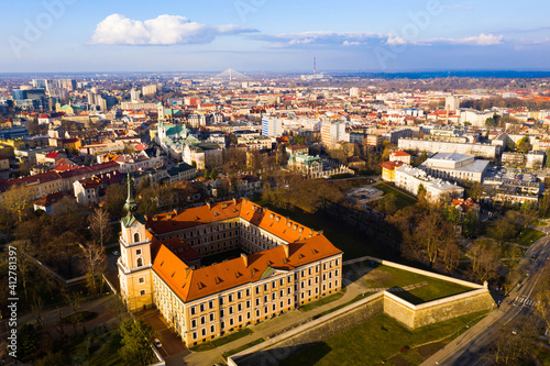 Aerial view of Renaissance building of Rzeszow castle on background of modern cityscape in springtime, Poland