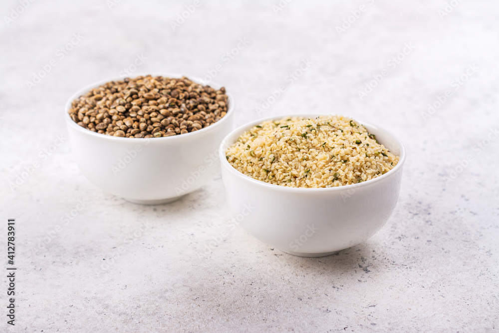 Organic hemp seeds on light background. Copy space Organic hemp seeds on light background. Copy space