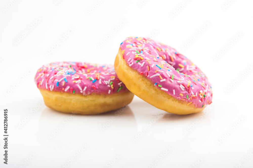Two pink donuts on a white background