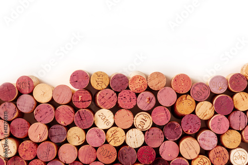 Wine corks background, a design template for a restaurant menu or winery brochure, shot from the top with a place for text, on a white background