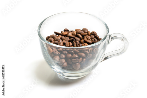 roasted coffee beans in a glass cup isolated on a white background