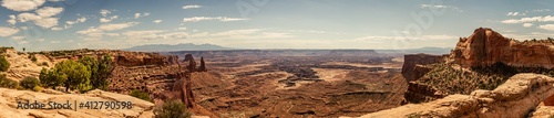 Panorama shot of sandy red canyons in island in the sky at sunny day of part canyonland national park in Utah, america