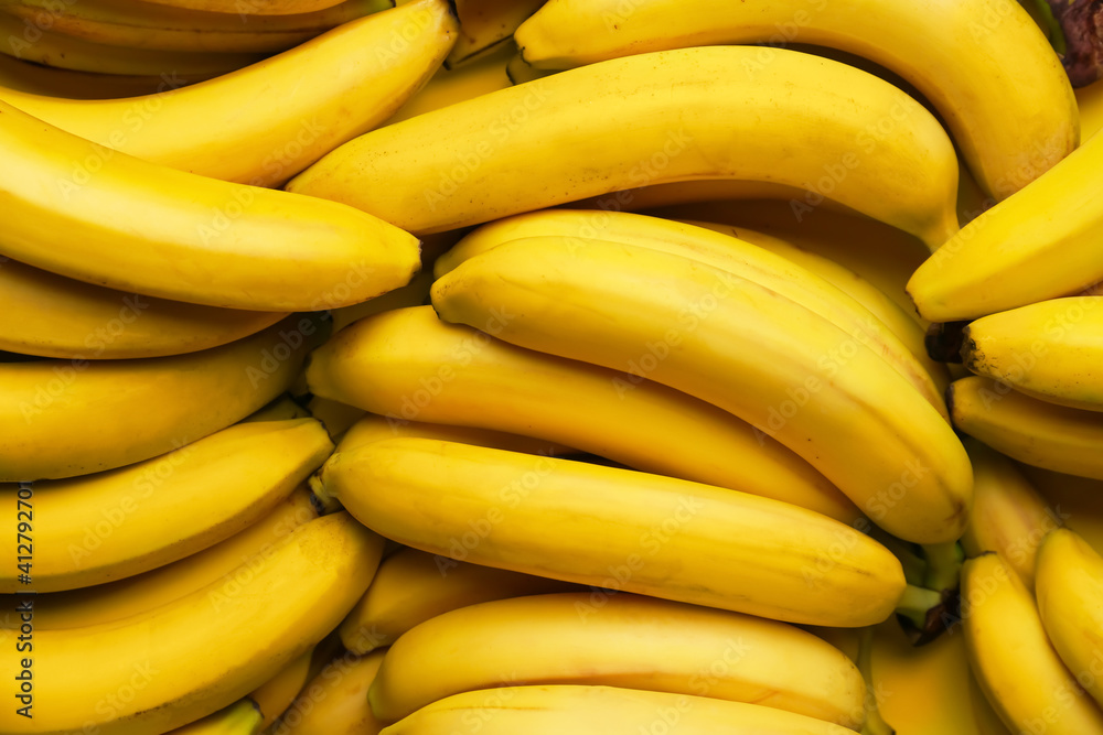 Tasty ripe bananas as background