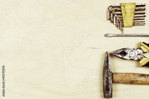Retro vintage equipment set on brown texture wooden background. Old tools handy craft concept. Top view flat lay