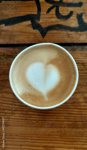 Americano with milk and heart-shaped foam