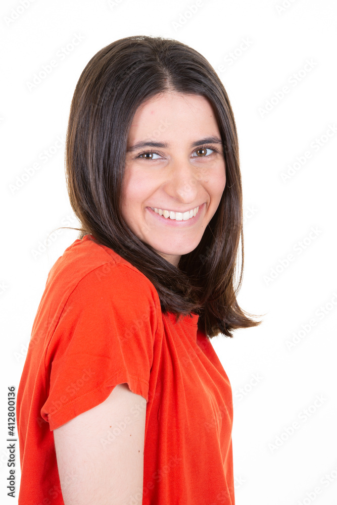 Smiling attractive young brunette woman posing in close up portrait in white studio shot Smiling attractive young brunette woman posing in close up portrait in white studio shot