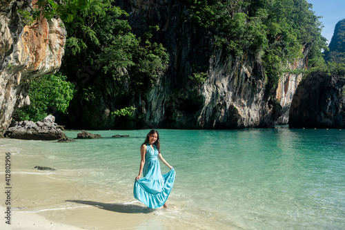 happy asian woman standing on clear blue water beach at Lao Lading island  andaman sea  travel destination in Krabi Province  Thailand