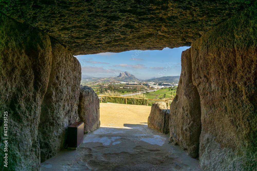 view out of the entrance of the Dolmen de Menga in Antequera