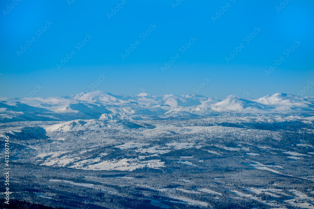 View over a majestic wilderness landscape in winter with clear blue skies.