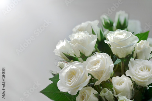 White roses bouquet on white background with soft focus