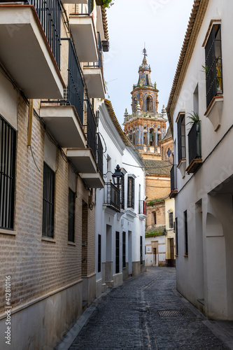 St. Mary Parish Church with a narrow street in front in the old city center of Ecija