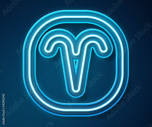 Glowing neon line Aries zodiac sign icon isolated on blue background. Astrological horoscope collection. Vector.