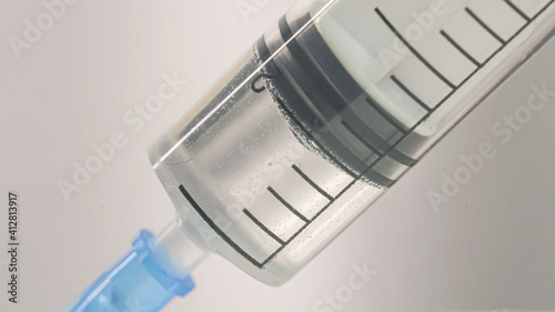 close-up of a medical syringe with medicine. Injection with a plastic syringe. Mandatory vaccination. photo