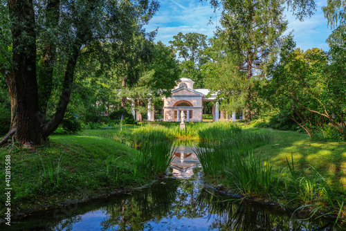 View of the pavilion "Aviary "(poultry house) from the side of the Aviary Pond in the Pavlovsk Palace and Park Complex, Saint Petersburg, Russia