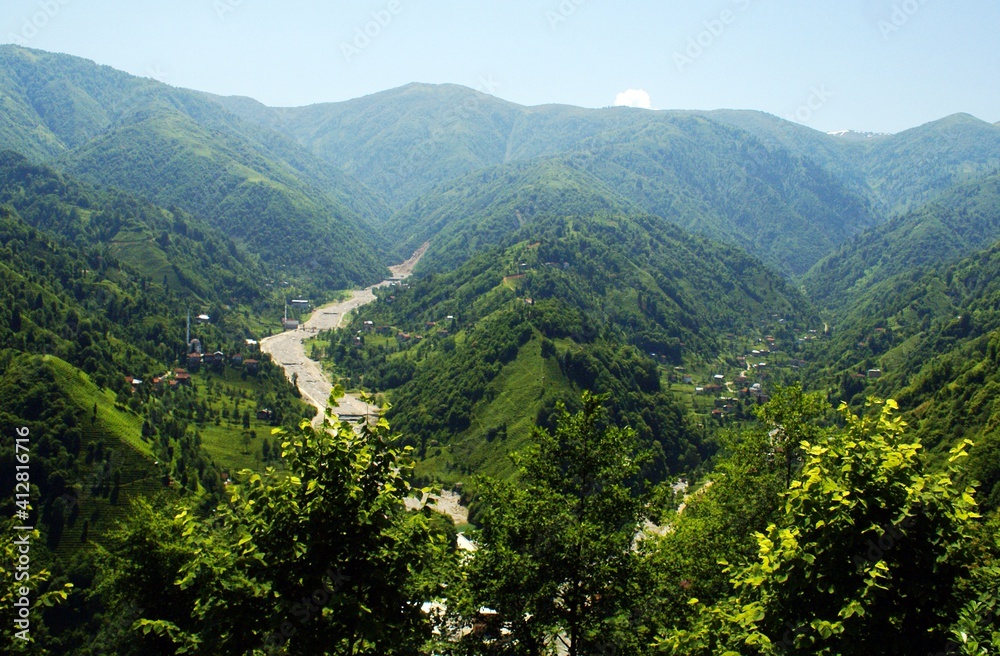 Fototapeta premium A panoramic shot of nature. There is a valley which is separated from each other with paths that lead to different directions.