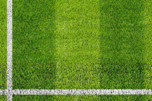 Top view of the white Line marking on the artificial green grass soccer field.