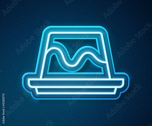 Glowing neon line Pudding custard with caramel glaze icon isolated on blue background. Vector.