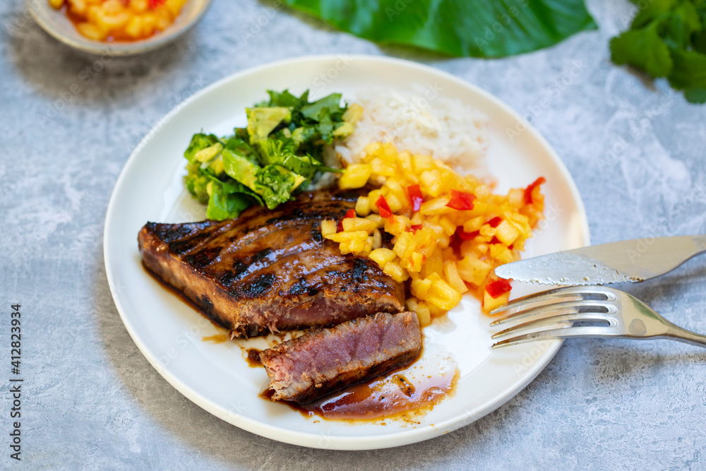 Seared tuna steak with pineapple salsa, rice and avocado Seared tuna steak with pineapple salsa, rice and avocado