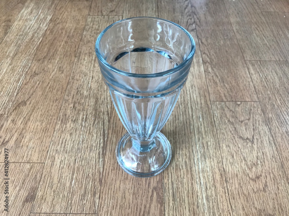 glass of water on the wood table glass of water on the wood table
