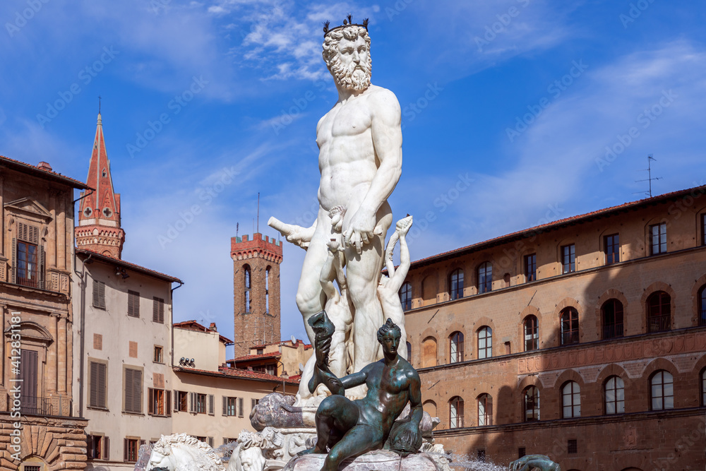 Famous Fountain of Neptune on the background of a beautiful blue sky. Florence, Italy