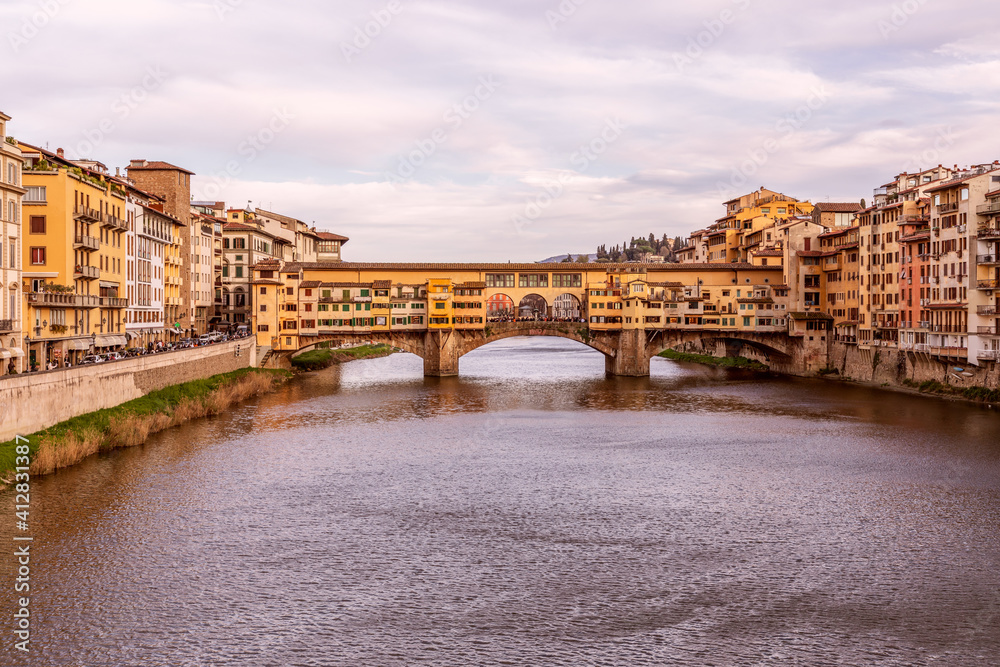 Beautiful evening over the famous bridge Ponte Vecchio over Arno river in Florence, Italy