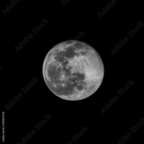 crisp structured and bright full moon in a black nightv sky