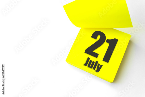 July 21st . Day 21 of month, Calendar date. Close-Up Blank Yellow paper reminder sticky note on White Background. Summer month, day of the year concept.