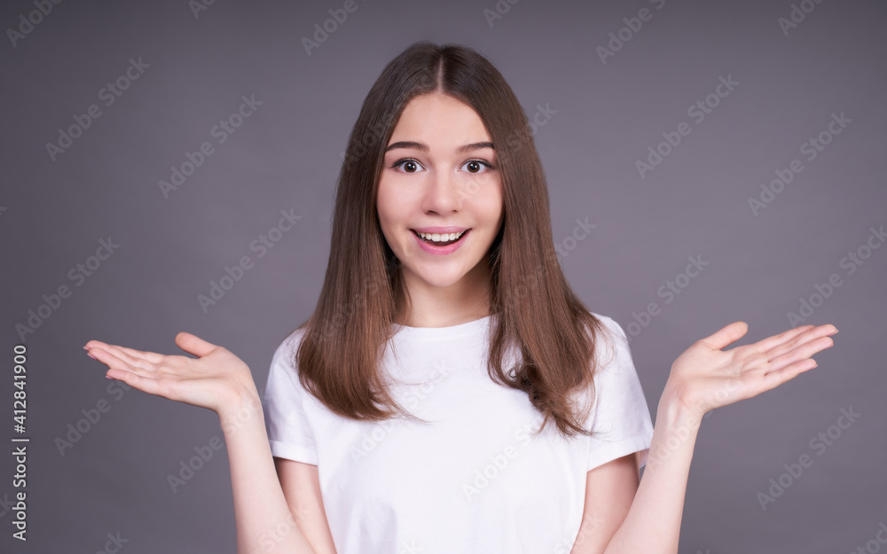 Surprised young girl with her hands to the side. Surprised young girl with her hands to the side.