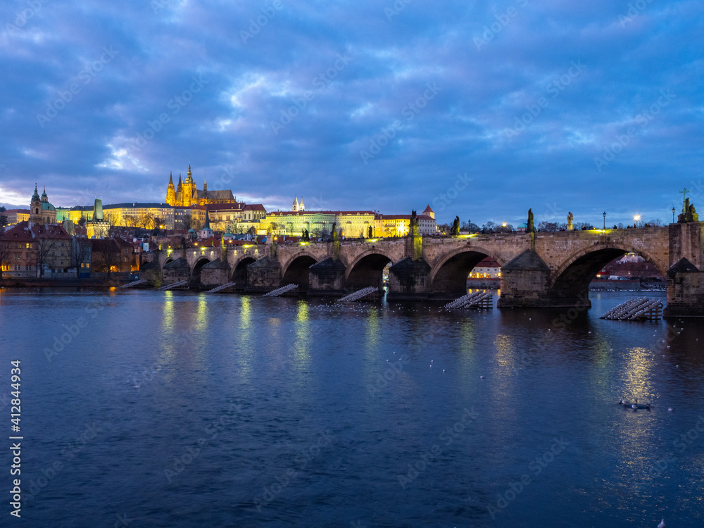 Prague Castle and Charles Bridge in twilight. Prague, Czech Republic. December 10, 2019