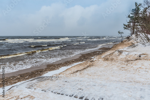 Footpath between winter Baltic Sea s dunes in Saulkrasti in Latvia photo