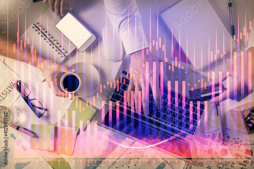 Double exposure of man and woman working together and forex graph hologram drawing. Financial analysis concept. Computer background. Top View.