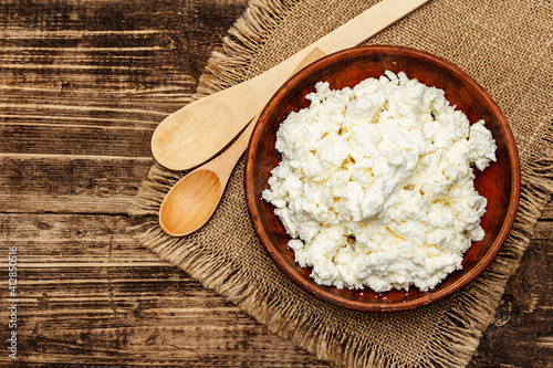 Organic homemade cottage cheese or curd in bowl photo