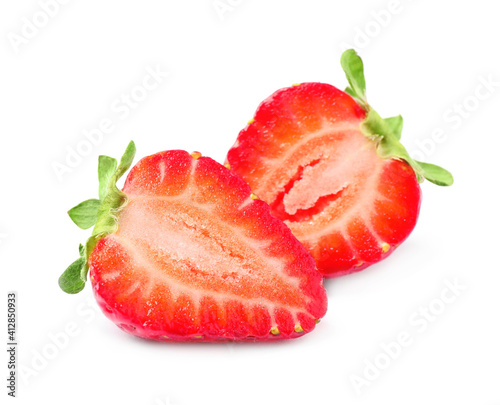 Halves of delicious red strawberry on white background