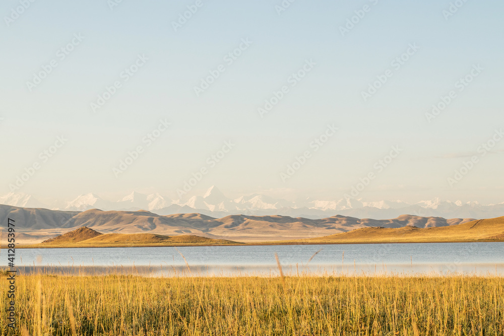 Lake Tuzkol in Kazakhstan and a view of Khan Tengri peak at sunrise Lake Tuzkol in Kazakhstan and a view of Khan Tengri peak at sunrise