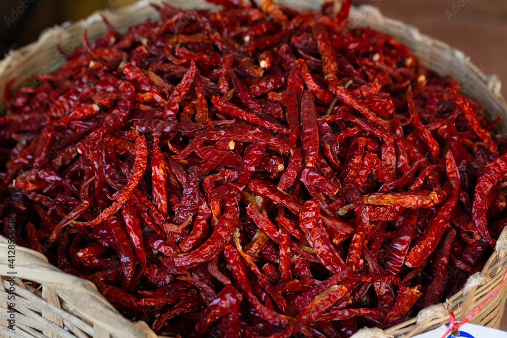 Fototapeta premium organic dried red spicy chillies in market. Dried chillies in Thailand's Food Market for background. 