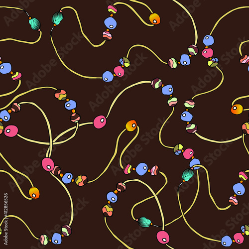Pattern from decorative beads for design. Seamless pattern on a brown background. Vector illustration.