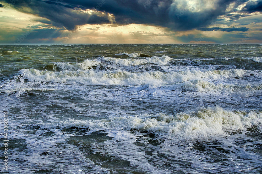 sunset over the stormy sea