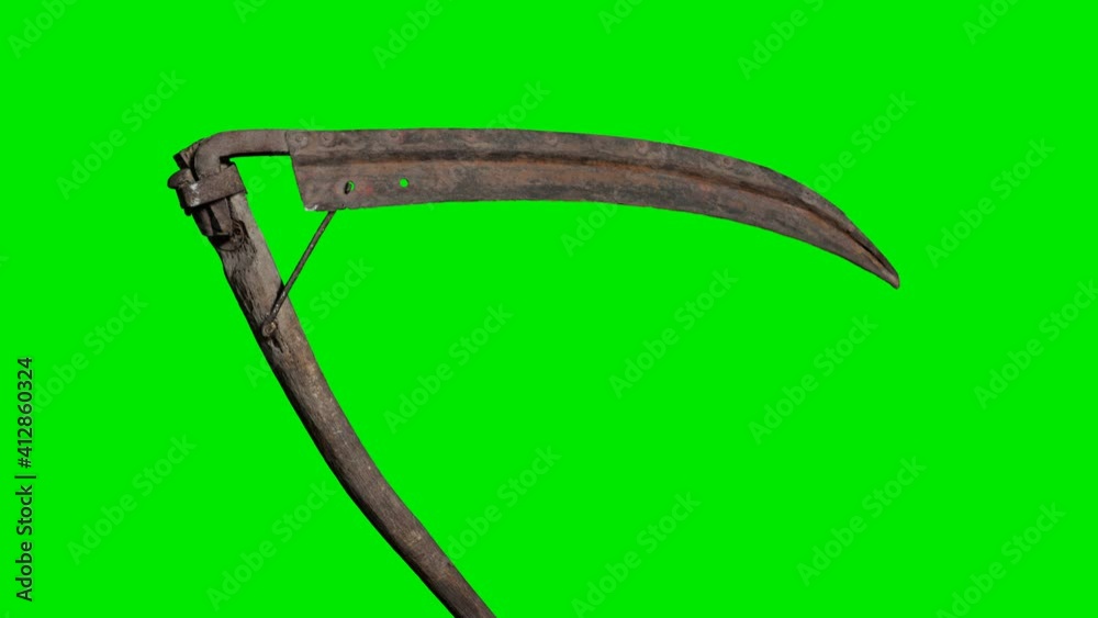 Ancient rusted metal scythe on green chromakey background