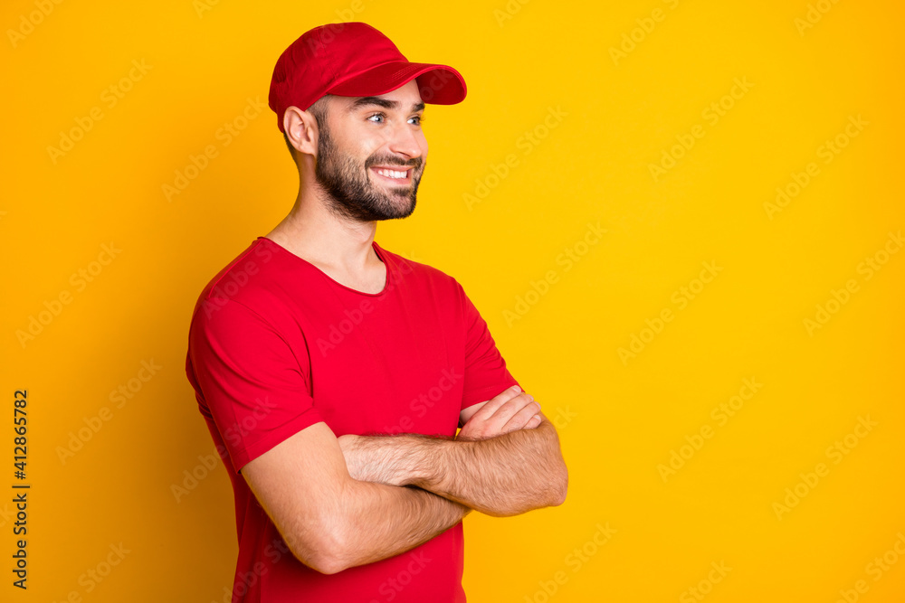 Profile side view portrait of attractive cheerful content guy mailman folded arms copy space isolated over vivid yellow color background