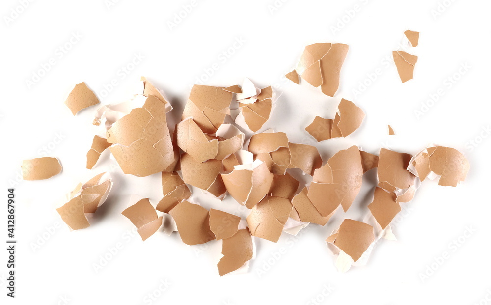 Cracked eggshell pile, crushed egg shells isolated on white background, top view Cracked eggshell pile, crushed egg shells isolated on white background, top view