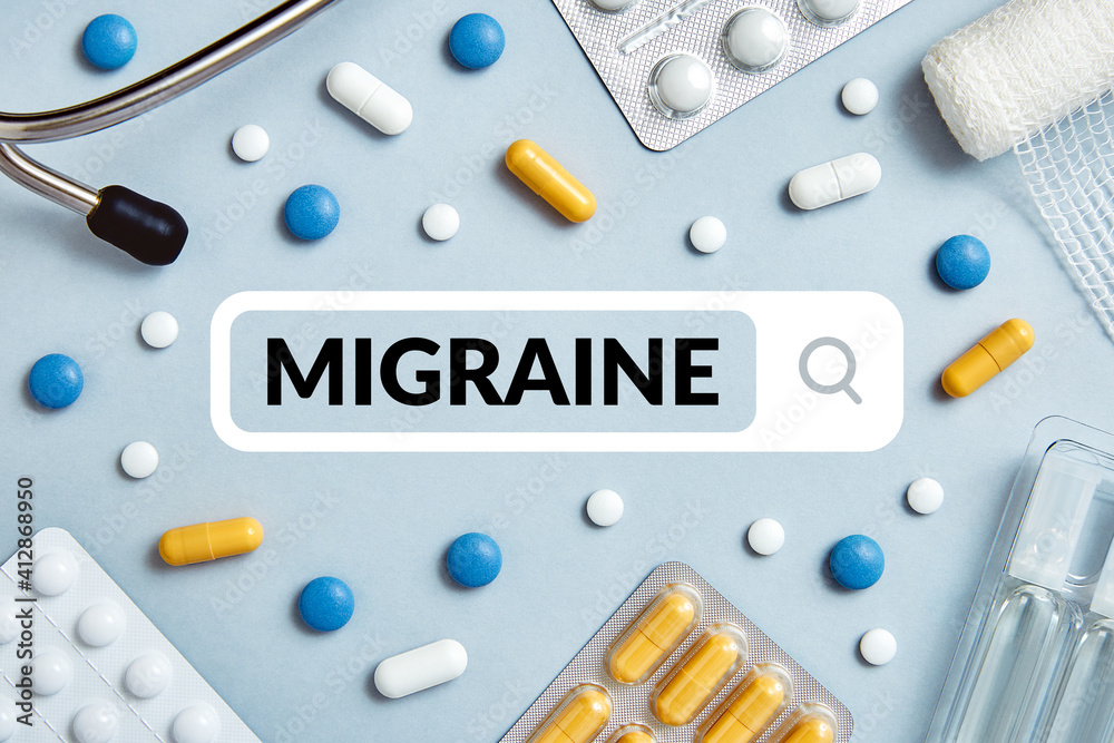 Migraine disease, medical concept surrounded by pills and medical supplies on blue background. Top view Migraine disease, medical concept surrounded by pills and medical supplies on blue background. Top view