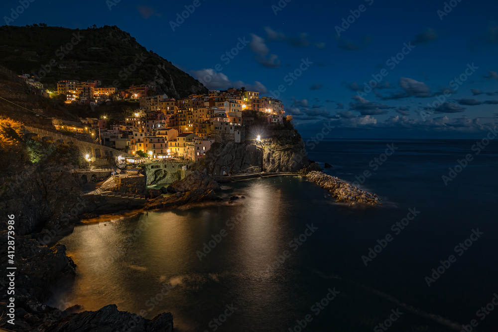 Manarola village at sunset on Mediterranean sea in National park Cinque Terre, La Spezia, Liguria, Italya