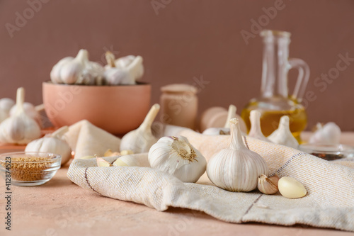 Fresh garlic on color background