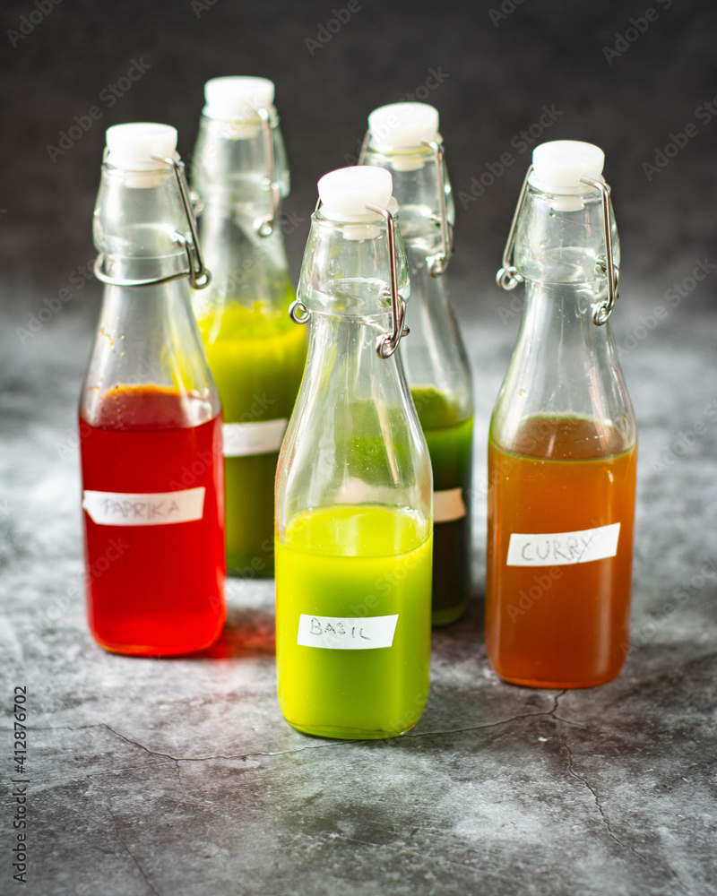 Beautiful selection of cooking aromatic oils.Made with fresh herbs and spices. Beautiful selection of cooking aromatic oils.Made with fresh herbs and spices.