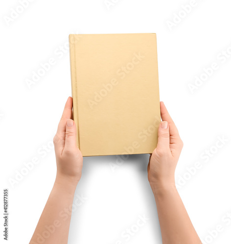 Female hands with blank book on white background © Pixel-Shot