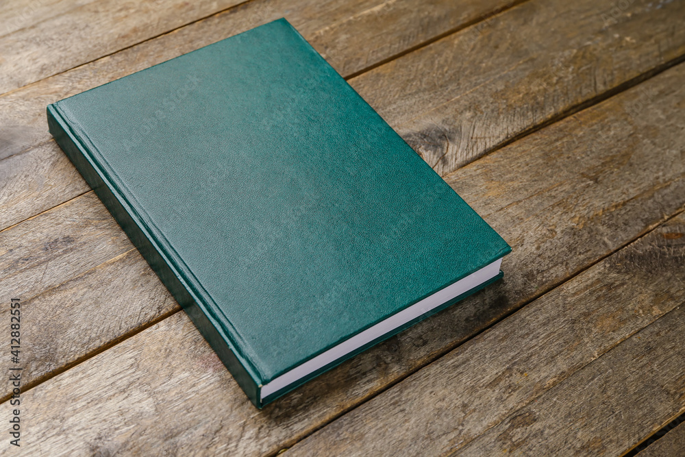 Blank book on wooden background Blank book on wooden background