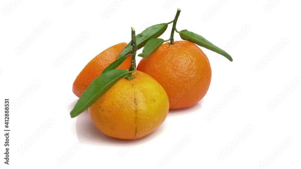 sliced tangerine with leaves isolated on white background sliced tangerine with leaves isolated on white background